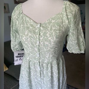 Green dress with functioning buttons in the front
